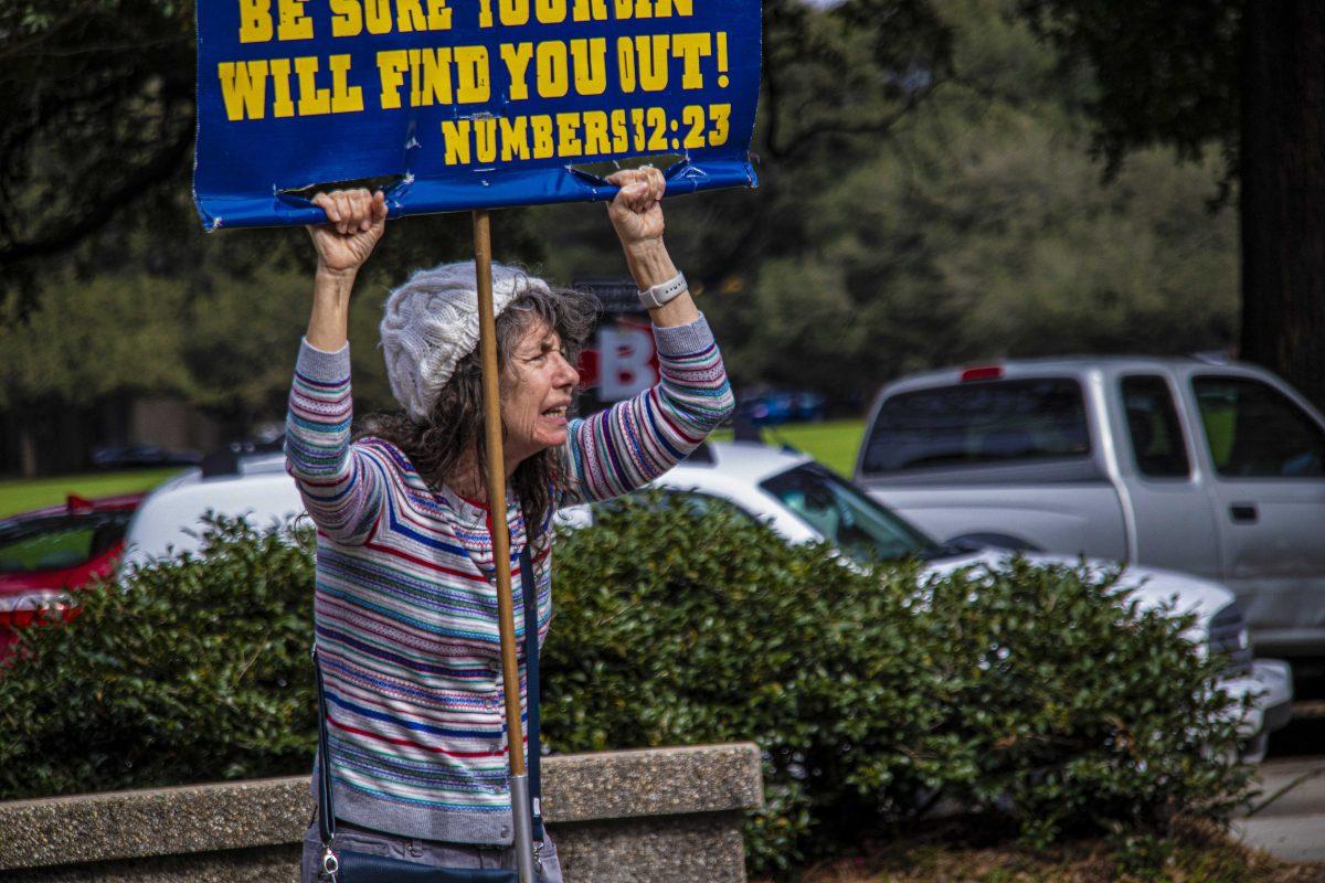 Sister Cindy holds a sign displaying the countless sins of the 21st Century on Wednesday, January 15, 2020 during her time preaching to students on LSU's campus the first week of Spring Semester 2020 in Free Speech Plaza.