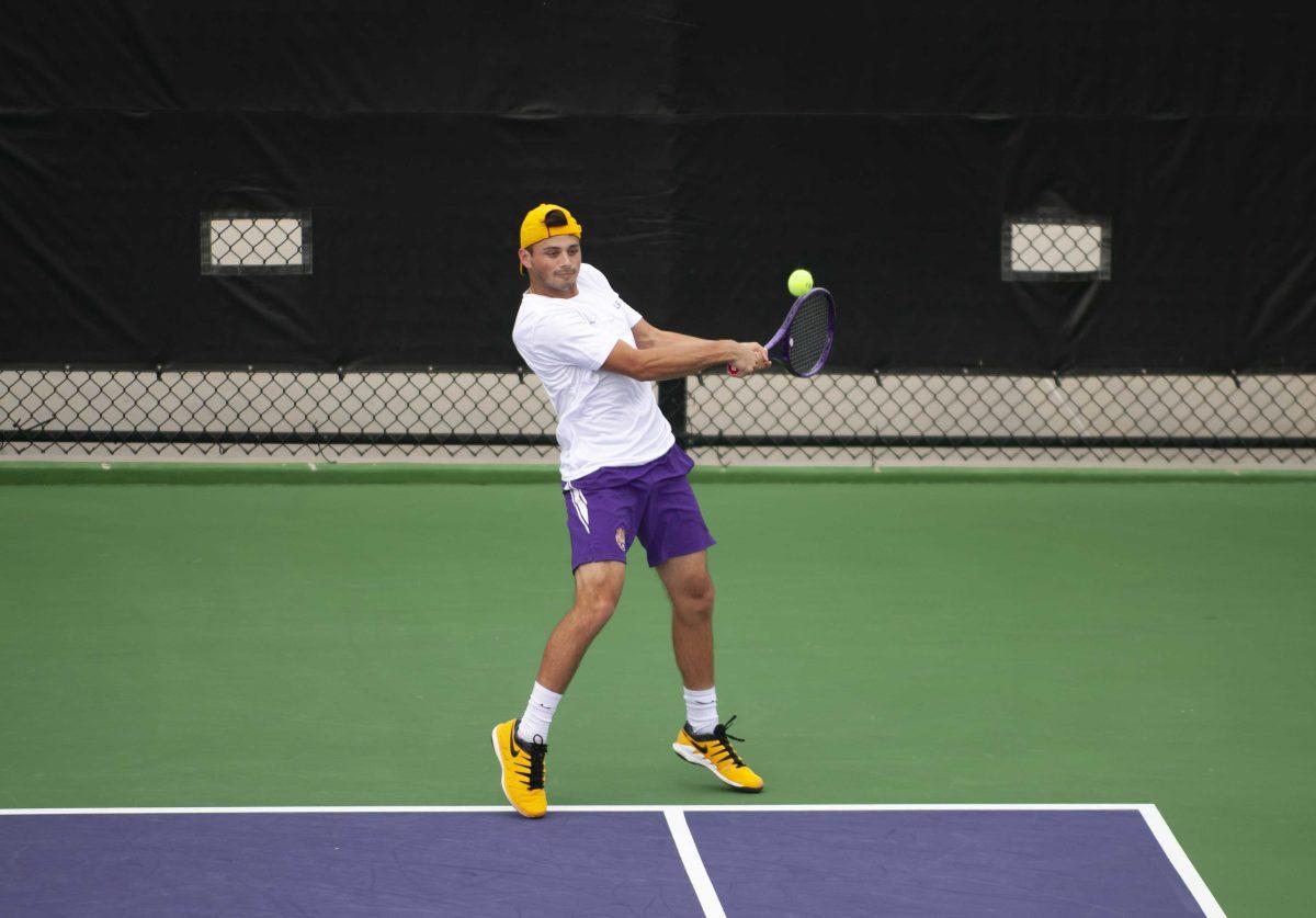 LSU men&#8217;s tennis redshirt freshman Ronald Hohmann attempts to hit Sunday, Feb. 28, 2021 during LSU&#8217;s 1-4 loss against South Carolina in the LSU Tennis Complex on Gourrier Avenue in Baton Rouge.the ball