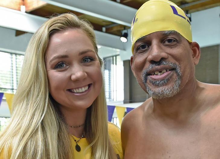 LSU swimmer Kit Hanley and Herman Kelly pose for a photo at LSU's UREC. Hanley has coached Kelly to wins in many swimming competitions.&#160;