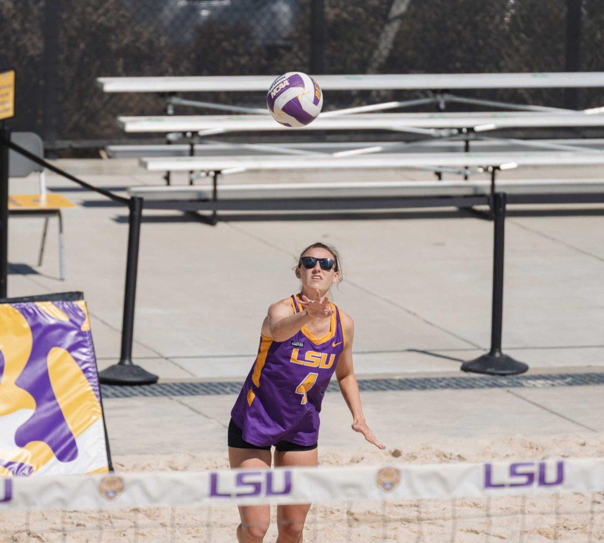 LSU beach volleyball junior Melia Lindner (4) serves the ball on Mar. 6, 2021 during LSU&#8217;s win over Florida Atlantic University at the beach volleyball stadium on Cypress Dr.