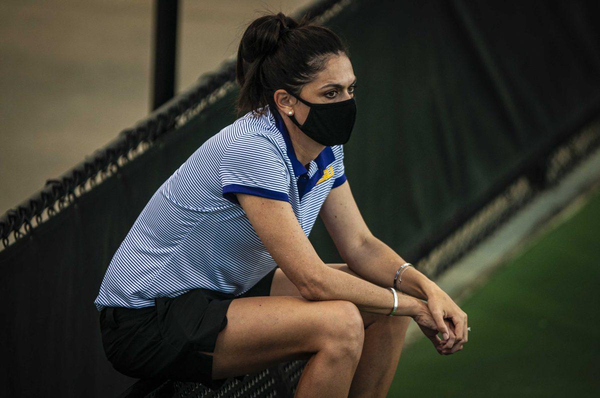 LSU women&#8217;s tennis co-Head Coach Julia Sell surveys the action Friday, March 12, 2021 during LSU&#8217;s 4-0 loss against Georgia in the LSU Tennis Complex on Gourrier Avenue in Baton Rouge.