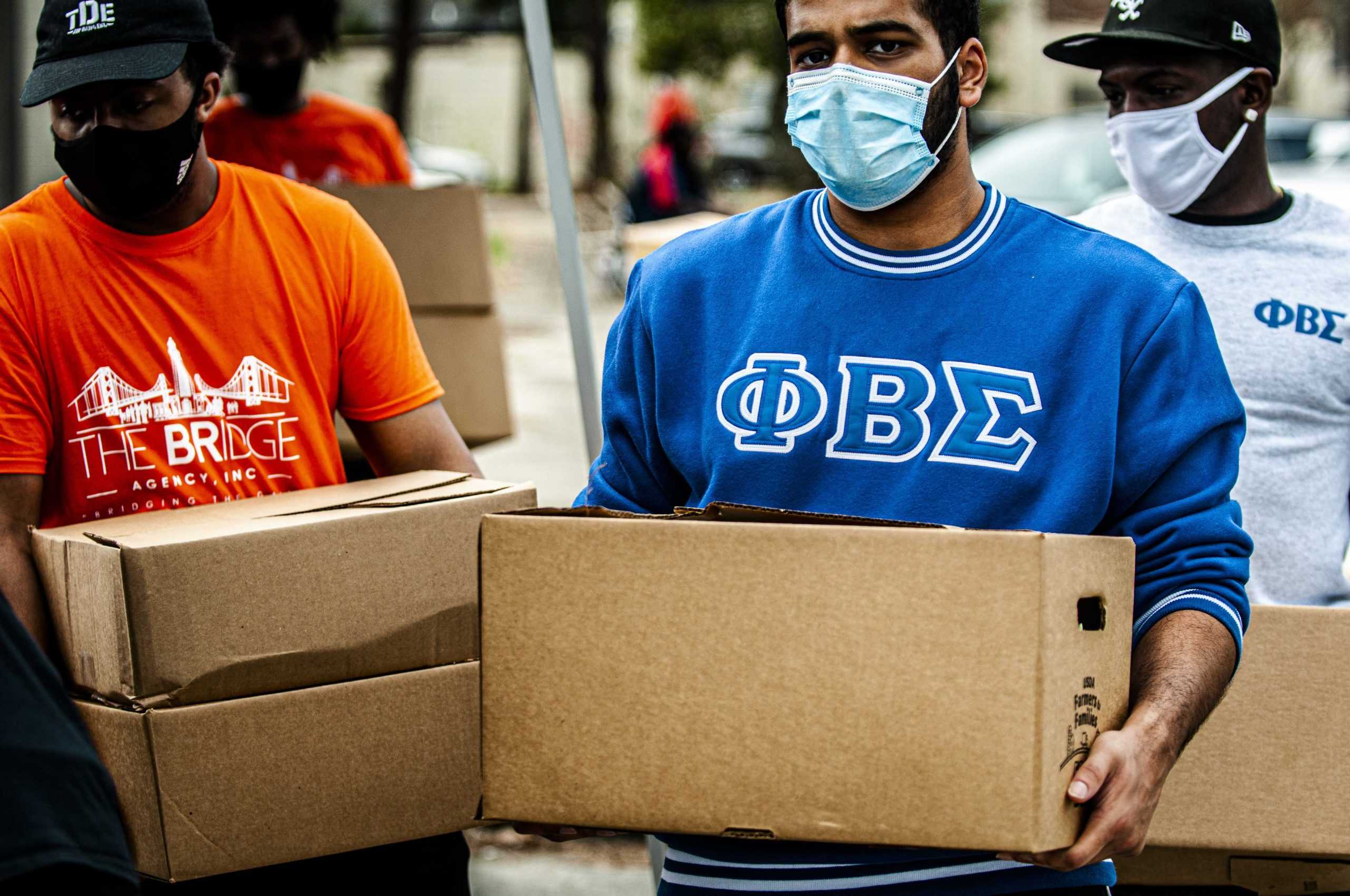 PHOTOS: LSU Students Volunteer At "Hand It On" Food Drive