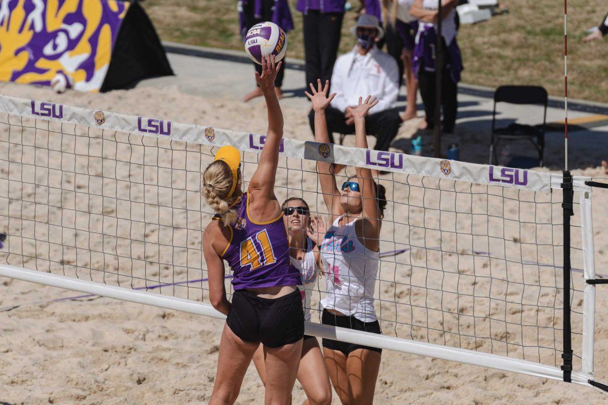 LSU beach volleyball grad student Jess Lansman (41) taps the ball over the net on Mar. 6, 2021 during LSU&#8217;s win over Florida Atlantic University at the beach volleyball stadium on Cypress Dr.