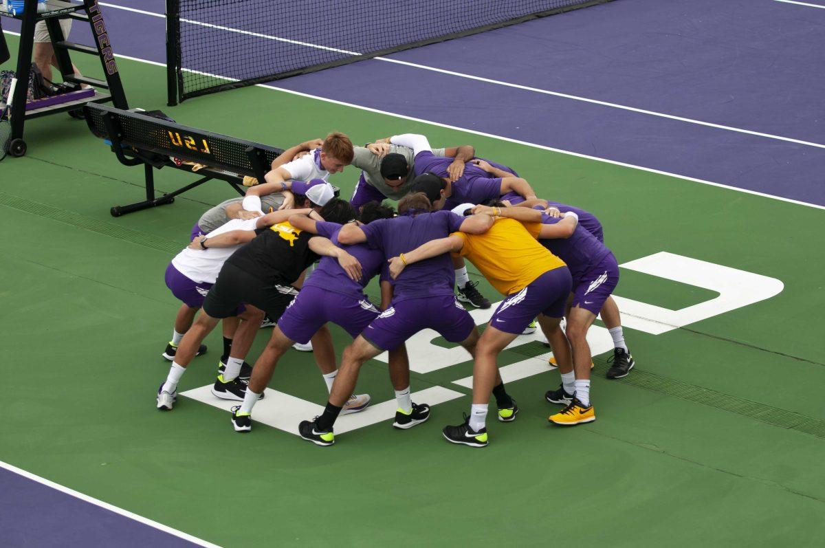 The LSU men's tennis team cheer together before the match Sunday, Feb. 28, 2021 during LSU&#8217;s 1-4 loss against South Carolina in the LSU Tennis Complex on Gourrier Avenue in Baton Rouge.