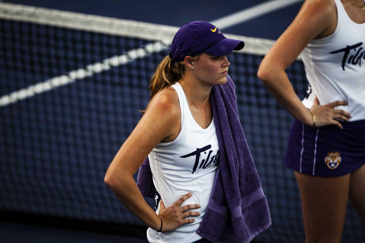 LSU women&#8217;s tennis sophomore Maggie Cubitt watches her teammates play in between doubles Friday, March 12, 2021 during LSU&#8217;s 4-0 loss against Georgia in the LSU Tennis Complex on Gourrier Avenue in Baton Rouge.