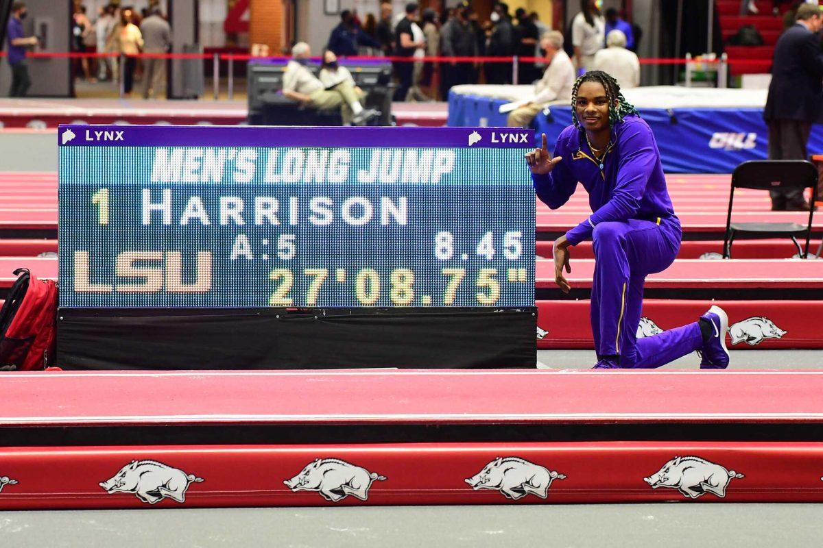 JuVaughn Harrison poses with scoreboard after making history at the NCAA Championships in Fayetteville, Arkansas.&#160;