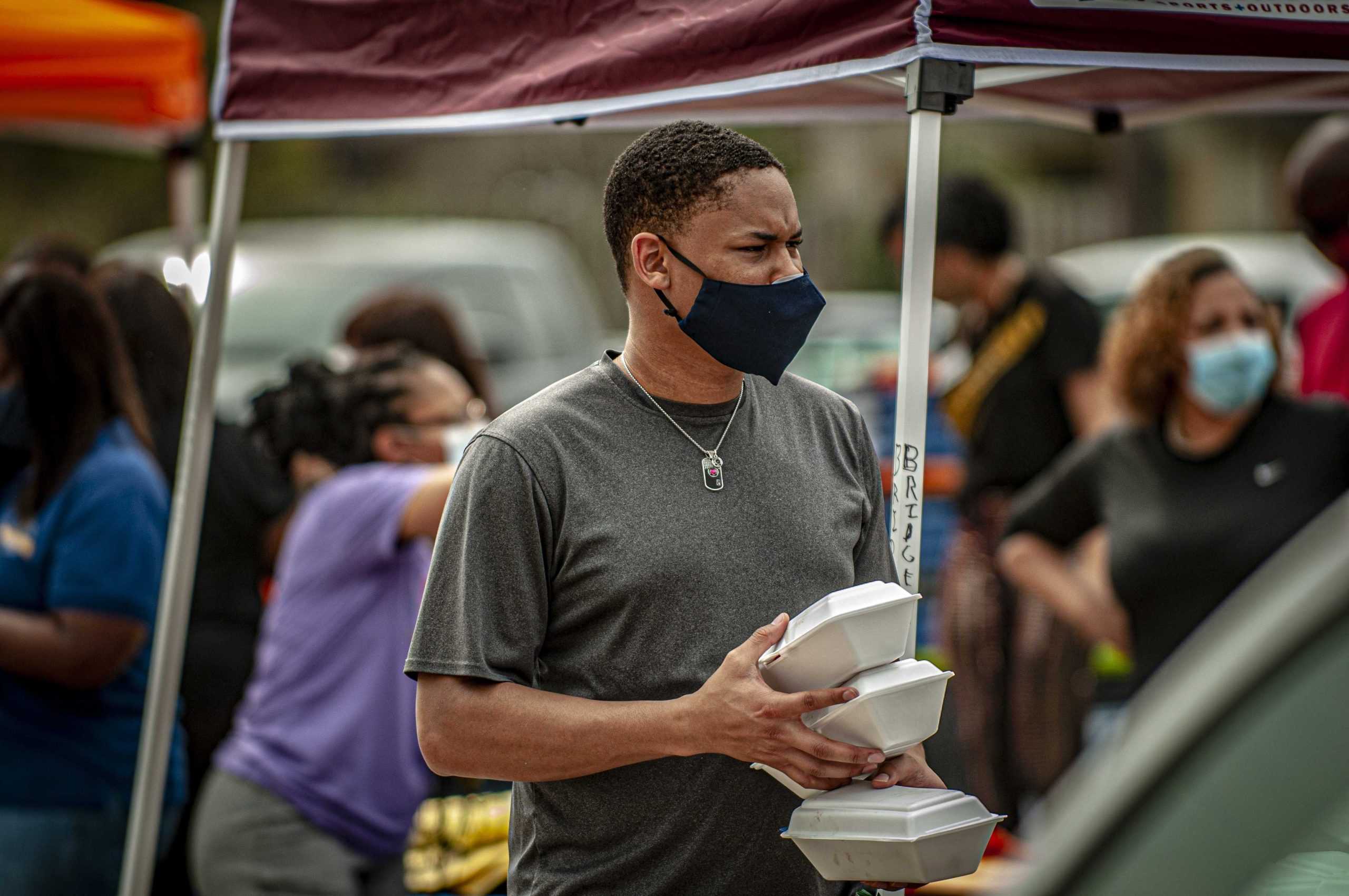 PHOTOS: LSU Students Volunteer At "Hand It On" Food Drive