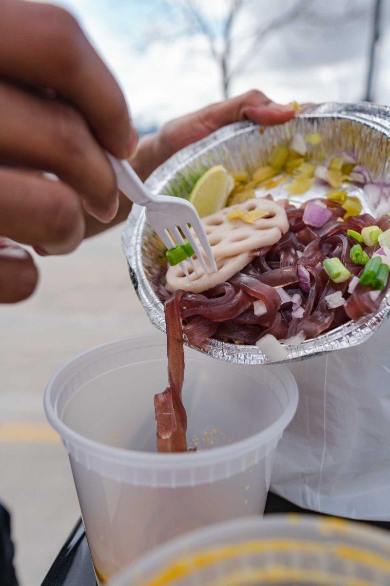 The purple sweet noodles and lotus root fall into the yellow curry soup and tofu of the Khao Soi Tofu (&#3586;&#3657;&#3634;&#3623;&#3595;&#3629;&#3618;) meal on Feb. 25, 2021 at 320 Lee Drive in Baton Rouge.