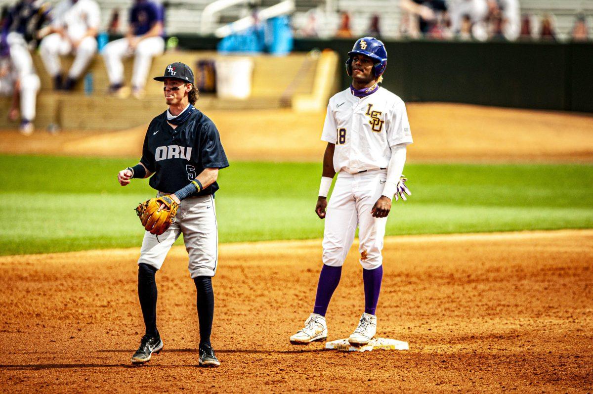 LSU baseball freshman first baseman Tre' Morgan (18) scans the field Friday, March 5, 2021 during LSU's 22-7 loss against Oral Roberts at Alex Box Stadium on Gourrier Avenue in Baton Rouge, La.