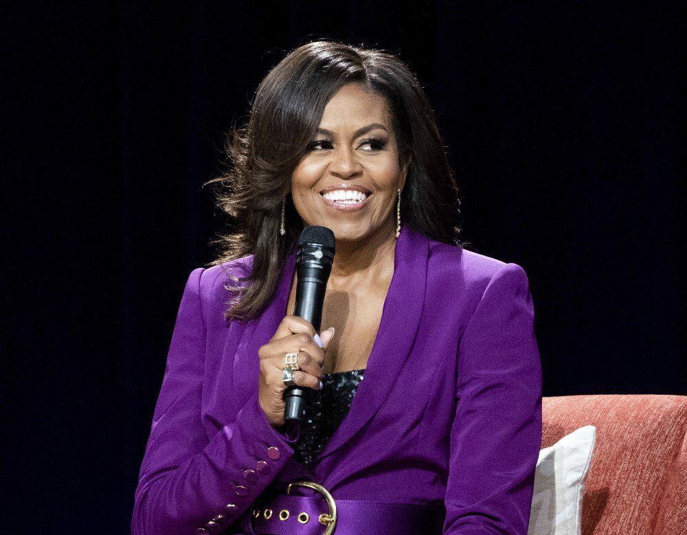 FILE - In this May 11, 2019, file photo, former first lady Michelle Obama speaks during an appearance in Atlanta. Obama and soccer star Mia Hamm are among those chosen for the 2021 National Women's Hall of Fame class announced Monday, March 8, 2021. Former PepsiCo Chief Executive Indra Nooyi and retired Brig. Gen. Rebecca Halstead, the first female commanding general at the strategic level during combat in Iraq, are also included along with several other women. The Women's Hall of Fame induction ceremony is scheduled for Oct. 2, 2021. (Photo by Paul R. Giunta/Invision/AP, File)