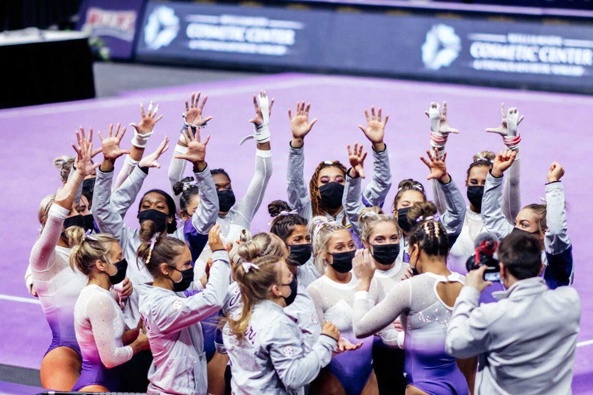 LSU gymnastics team throws up ten fingers after senior all-around Haleigh Bryant's perfect vault routine Friday, March 3, 2021 during LSU's 197.875-196.175 win over Missouri in the Pete Maravich Assembly Center on N. Stadium Drive in Baton Rouge, La.