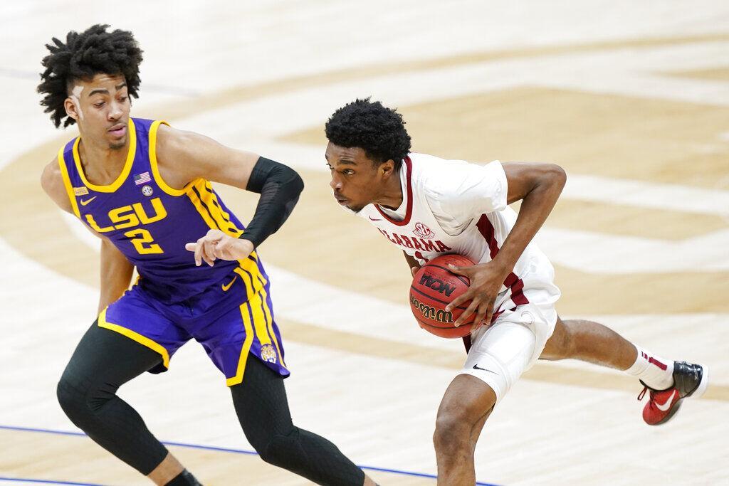 Alabama's Herbert Jones, right, is defended by LSU's Trendon Watford (2) during the first half of the championship game at the NCAA college basketball Southeastern Conference Tournament Sunday, March 14, 2021, in Nashville, Tenn.&#160;