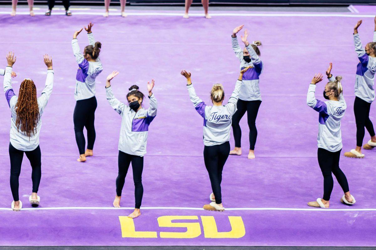 LSU gymnastics junior balance beam Rebecca D'Antonio waves goodbye with her teammates after the end of the last meet of the season Friday, March 3, 2021 during LSU's 197.875-196.175 win over Missouri in the Pete Maravich Assembly Center on N. Stadium Drive in Baton Rouge, La.