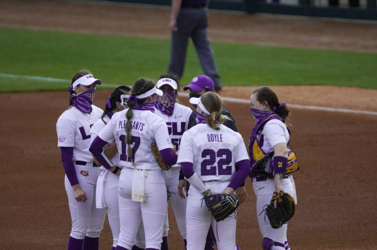 LSU softball players talk strategy Saturday, Feb. 27, 2021 during LSU's 3-2 win over UL-Lafayette at Tiger Park on Skip Bertman Drive in Baton Rouge.