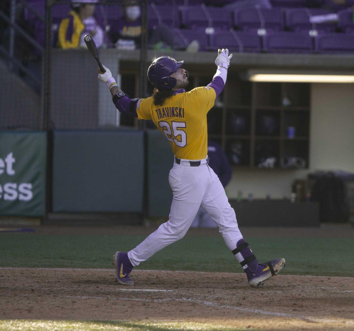 LSU baseball sophomore catcher Hayden Travinski (25) watches his hit Sunday, March 7, 2021 during LSU&#8217;s 1-3 loss against Oral Roberts in Alex Box Stadium on Gourrier Avenue in Baton Rouge.