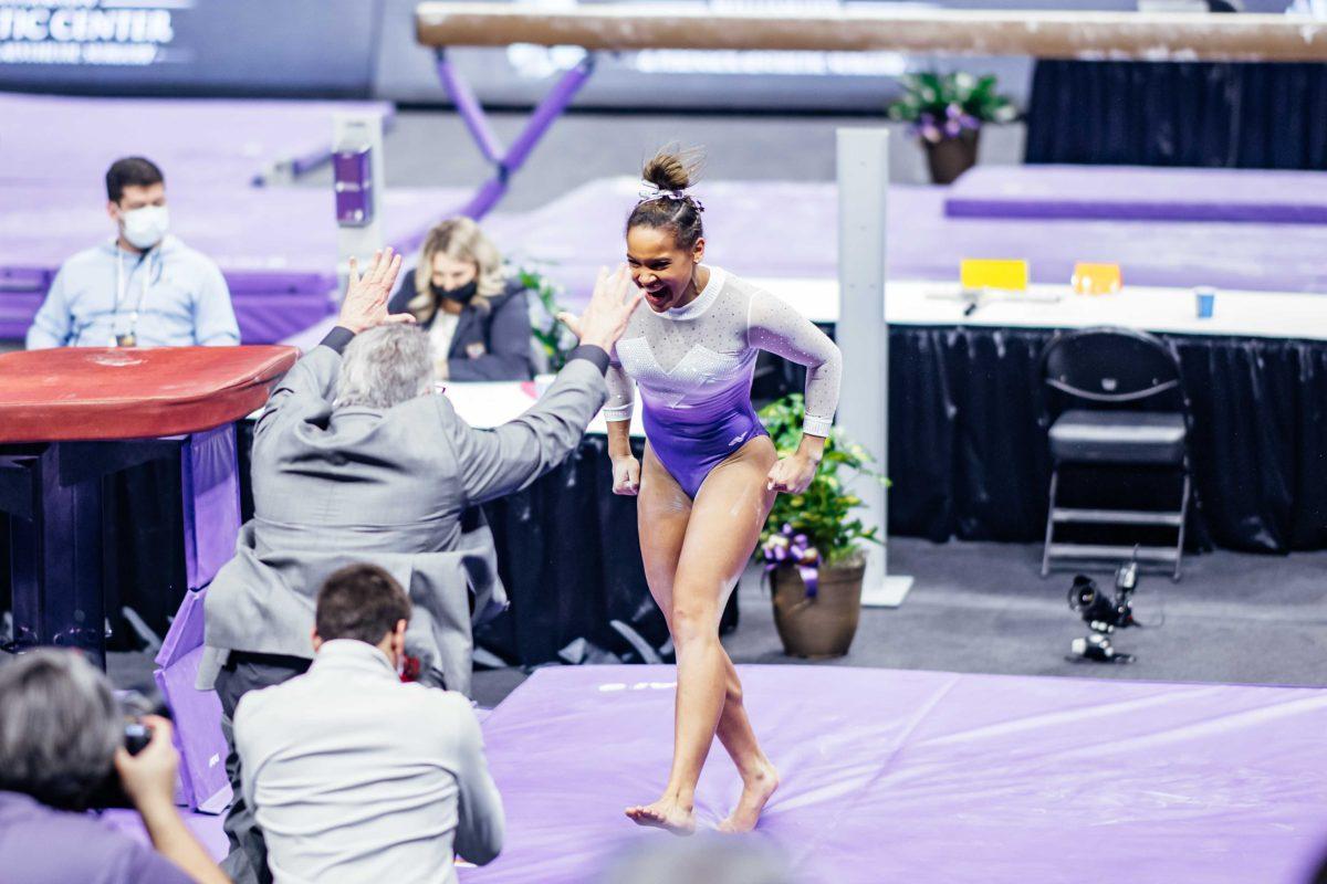 LSU gymnastics freshman all-around Haleigh Bryant cheers after her vault where she scored a perfect 10.00 Friday, March 3, 2021 during LSU's 197.875-196.175 win over Missouri in the Pete Maravich Assembly Center on N. Stadium Drive in Baton Rouge, La.