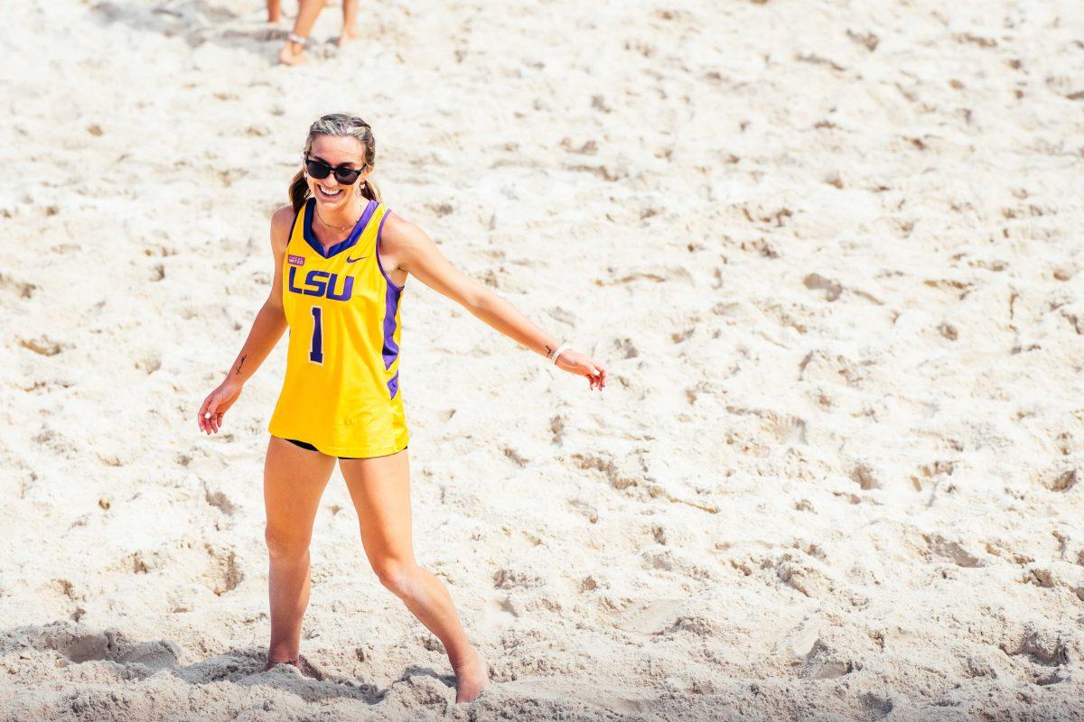 LSU beach volleyball junior Kelli Greene-Agnew (1) smiles after scoring a point Saturday, April 10, 2021 after they score a point during LSU's 5-0 win against New Orleans at the Beach Volleyball Stadium on Cypress Drive on LSU's campus.