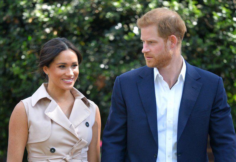 FILE - In this Oct. 2, 2019, file photo, Britain's Prince Harry and Meghan Markle appear at the Creative Industries and Business Reception at the British High Commissioner's residence in Johannesburg. Their first Netflix series will center on the Invictus Games, which gives sick and injured military personnel and veterans the opportunity to compete in sports. The Duke and Duchess of Sussex&#8217;s Archewell Productions announced Tuesday its first series to hit the streaming service. (Dominic Lipinski/Pool via AP, File)