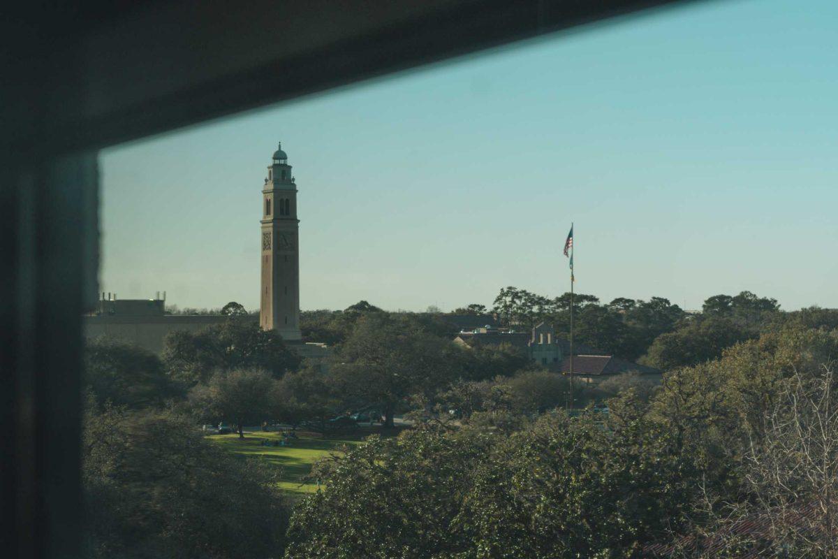 LSU&#8217;s Memorial Tower rises above the tree line on Mar. 3, 2021, from its location near the Parade Ground.