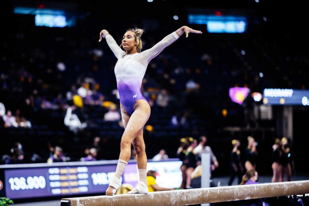 LSU gymnastics sophomore all-around Alyona Shchennikova performs her balance beam routine Friday, March 3, 2021 during LSU's 197.875-196.175 win over Missouri in the Pete Maravich Assembly Center on N. Stadium Drive in Baton Rouge, La.