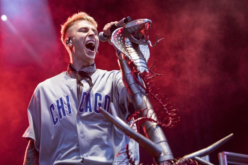 FILE - Machine Gun Kelly performs at Wrigley Field in Chicago, in this Saturday, Sept. 8, 2018, file photo. Grammy Award nominated rock &amp; soul duo Black Pumas and Cleveland's own Machine Gun Kelly ...