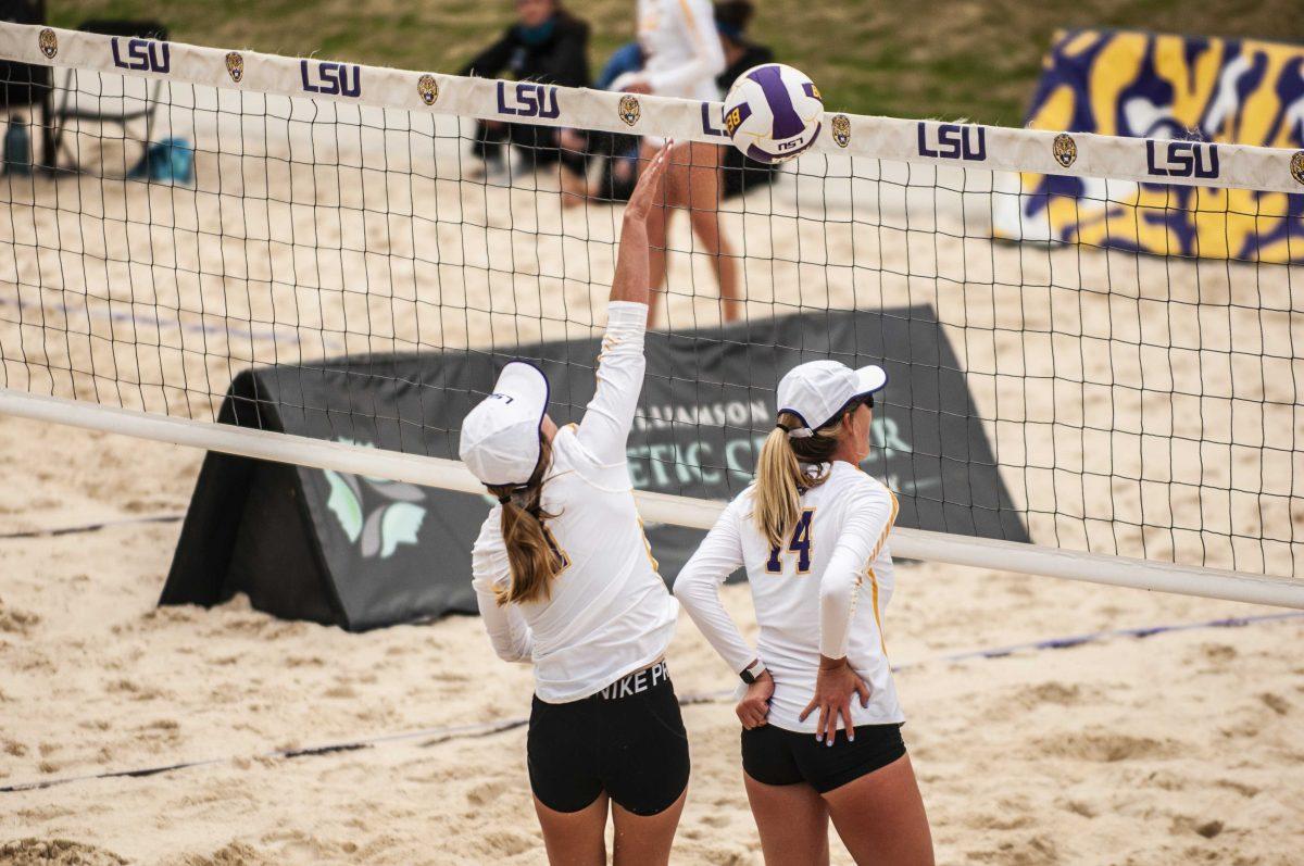 LSU beach volleyball junior Keli Greene-Agnew (1) hits the ball over the net during LSU's 5-0 victory against Texas A&amp;M Corpus Christi on Saturday, March 20, 2021 at the Beach Volleyball Complex.