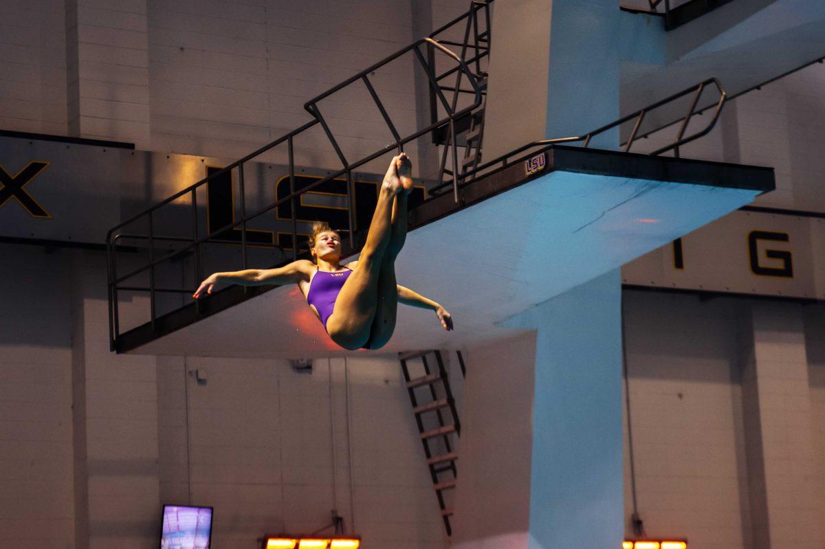 LSU diving sophomore Anne Tuxen dives into the pool Friday, Nov. 6 during the LSU swimming and diving vs. Alabama meet where men lost 194-84 and women lost 183-117 in the LSU Natatorium on W Chimes street in Baton Rouge, La.