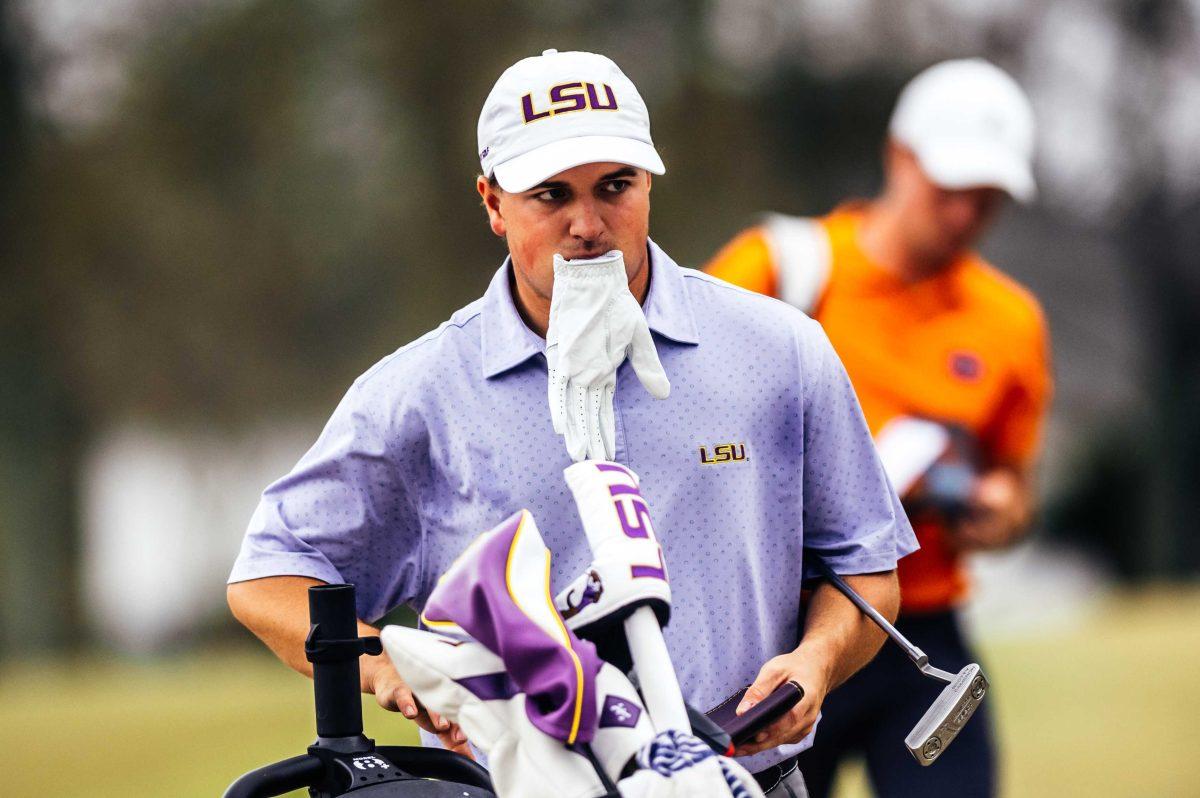 LSU men's golf freshman Nicholas Arcement looks around the course after he completes his first hole Friday, Feb. 26, 2021 during the LSU Invitational hosted at the University Club on Memorial Tower Drive in Baton Rouge, La.