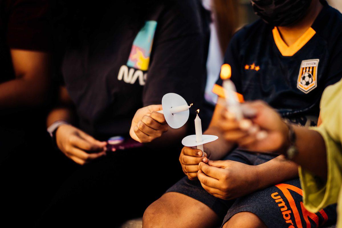 Friends and supporters of Kori light candles Sunday, April 11, 2021 during the candlelight prayer vigil for missing LSU freshman Kori Gauthier at Galvez Plaza in Downtown Baton Rouge.