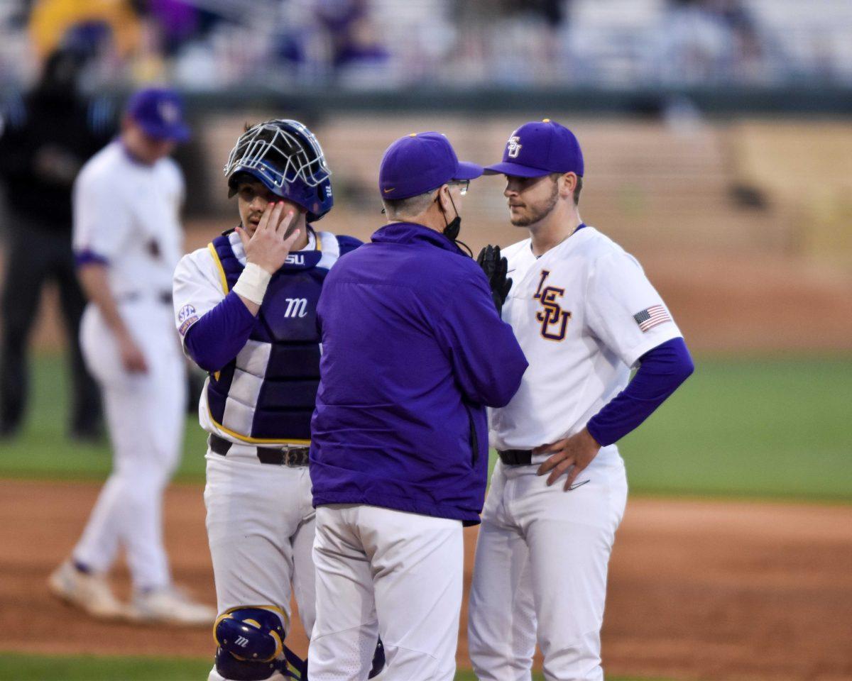 LSU baseball head coach Paul Mainieri meets with LSU baseball senior catcher Braden Doughty (45) and LSU baseball junior right-handed pitcher Landon Marceaux (11) on the mound Thursday, April 1, 2021 during LSU's 13-1 loss against Vanderbilt at Alex Box Stadium on Gourrier Avenue in Baton Rouge, La.