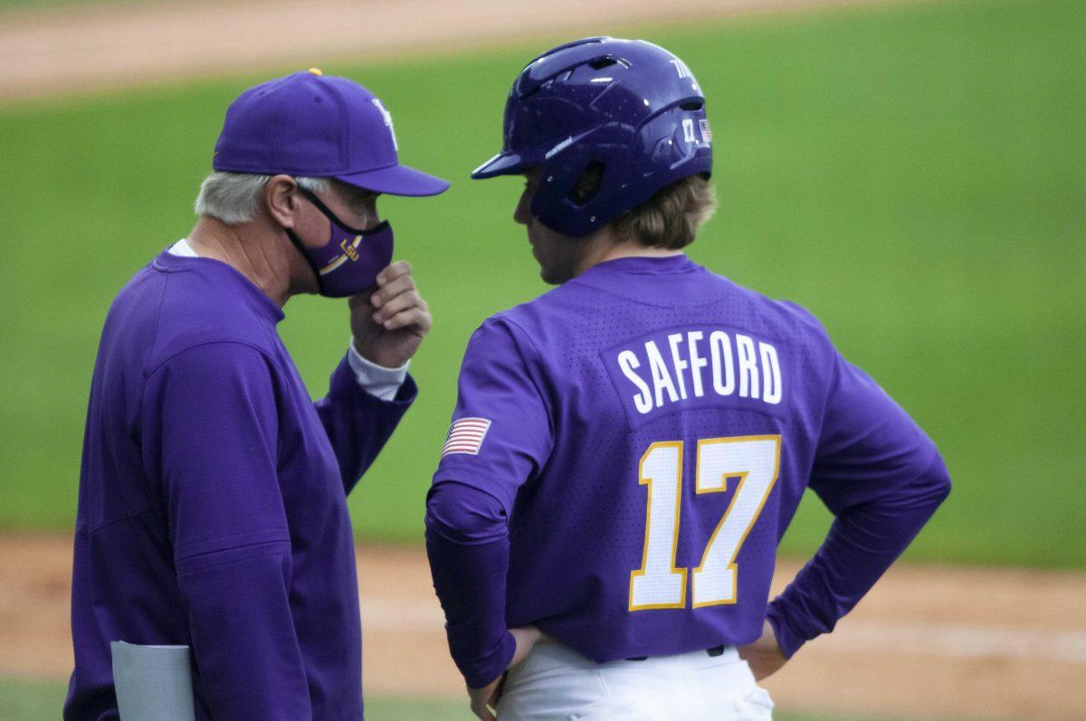 LSU baseball head coach Paul Mainieri and LSU baseball freshman utility Will Safford (17) talk strategy Saturday, April 17, 2021 during LSU&#8217;s 2-4 loss against South Carolina in Alex Box Stadium on Gourrier Avenue in Baton Rouge.