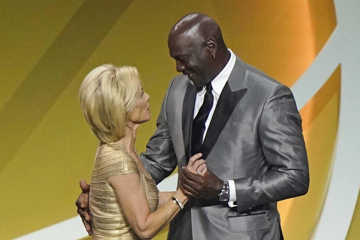 Presenter Michael Jordan, right, congratulates Kim Mulkey after Mulkey, formerly coach at Baylor and now at LSU, was enshrined with the 2020 Basketball Hall of Fame class, Saturday, May 15, 2021, in Uncasville, Conn. (AP Photo/Kathy Willens)