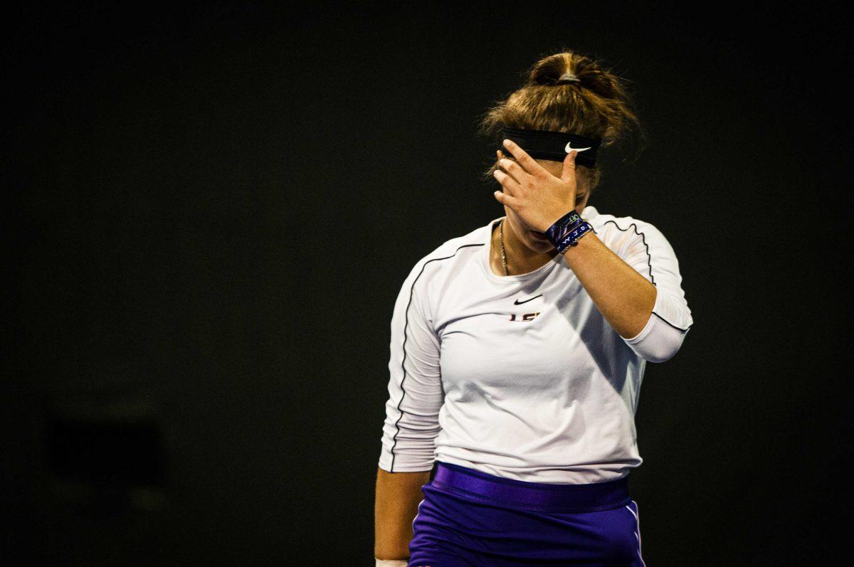 LSU women&#8217;s tennis sophomore Nina Geissler adjusts her headband Friday, March 12, 2021 during LSU&#8217;s 4-0 loss against Georgia in the LSU Tennis Complex on Gourrier Avenue in Baton Rouge.