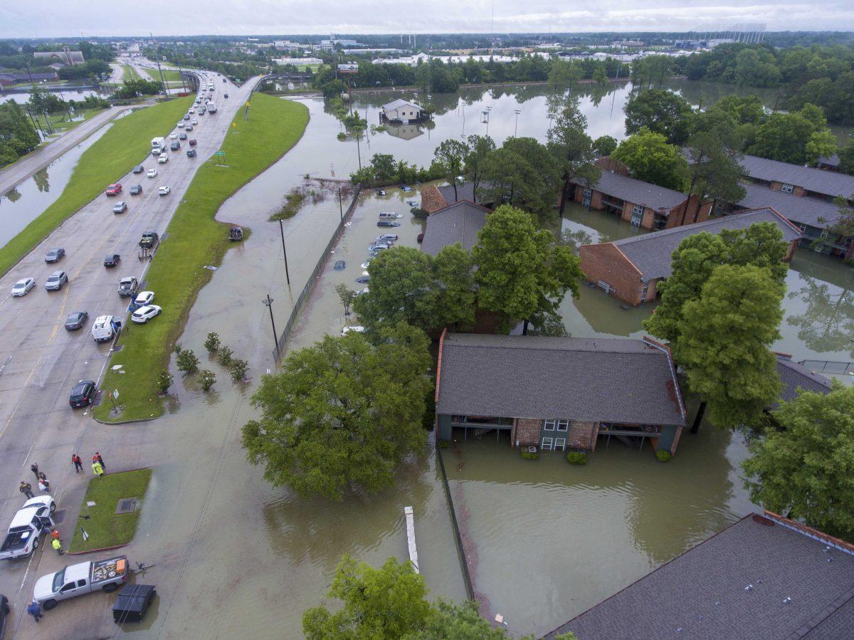 In this photo taken by a drone is an aerial view of the flooded Siegen Calais apartments Tuesday, May 18, 2021, in Baton Rouge, La. Heavy rains have swept across southern Louisiana, flooding homes, swamping cars and closing a major interstate. (John Ballance/The Advocate via AP)