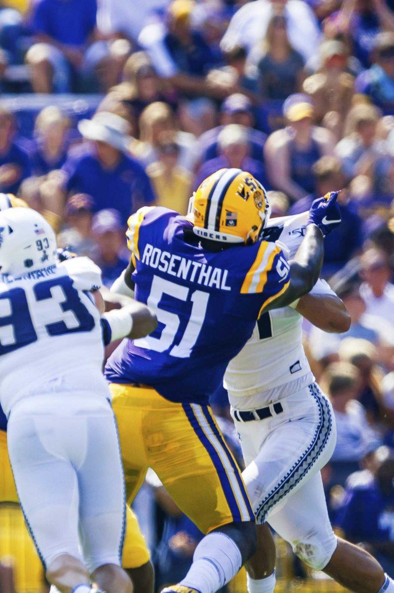 LSU freshman offensive tackle Dare Rosenthal (51) tackling the opposing team during the Tiger's 42-6 win against Utah State on Saturday, October 5, 2019 at Tiger Stadium.