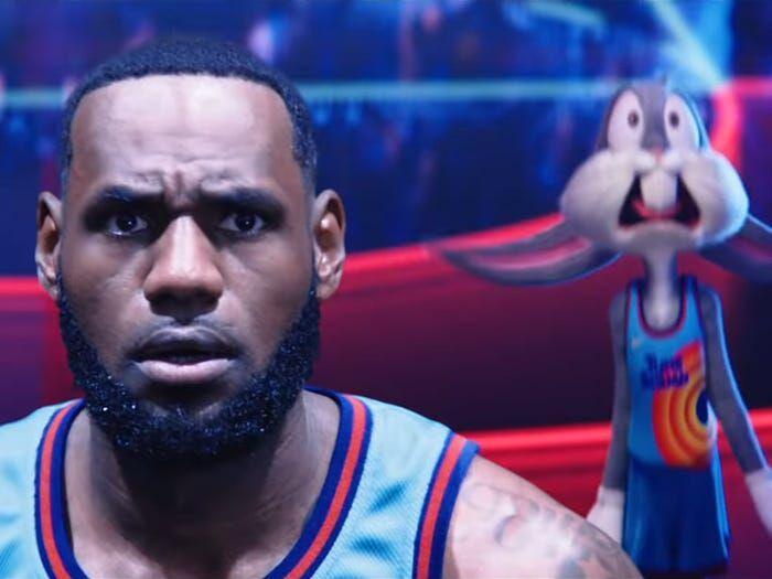 LeBron James (left) peers past the camera on the set of "Space Jam: A New Legacy," while Bugs Bunny (right) looks on in fear. Courtesy Warner Bros.