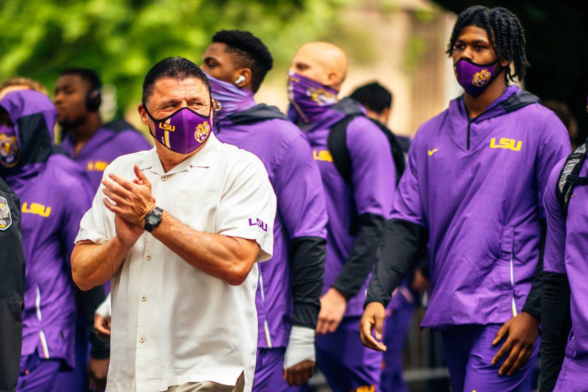 LSU football head coach Ed Orgeron walks down Victory Hill with his team Saturday, April 17, 2021 where the LSU football white team defeated purple 23-14 during their spring game at Tiger Stadium in Baton Rouge, La.