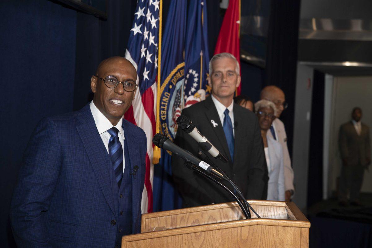 VA Deputy Secretary Donald Remy addresses audience at his swearing in ceremony at VA Central Office with VA Secretary Denis McDonough looking on.&#160;