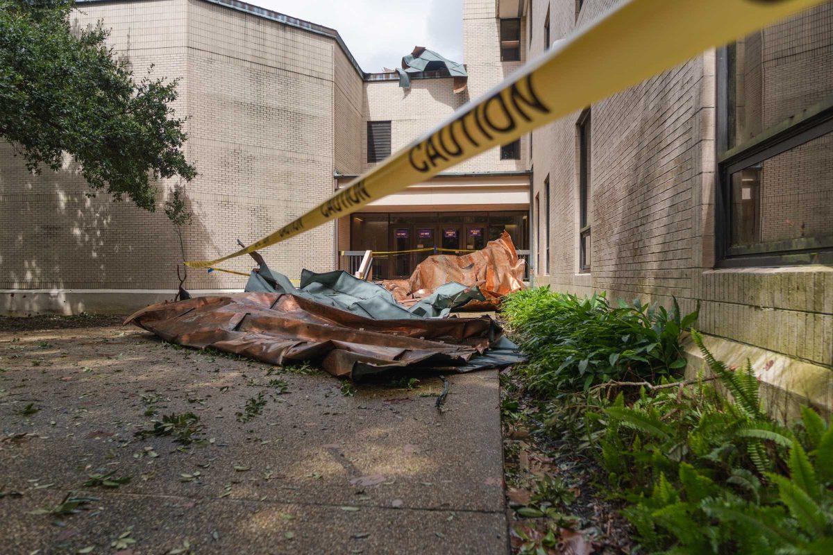 Roofing from the LSU School of Music sits on the ground Monday, Aug. 30, 2021, the day after Hurricane Ida hit South Louisiana, near a side entrance on Infirmary Road.