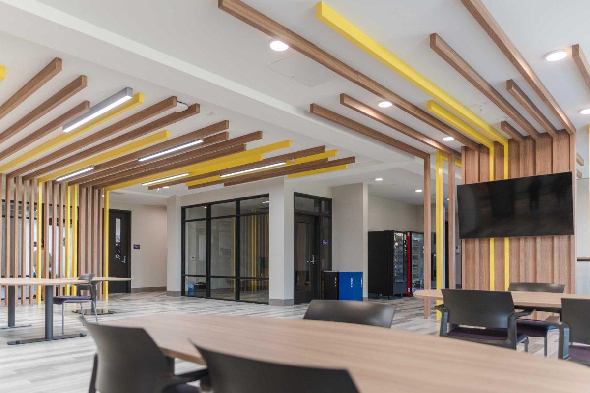 A decorative wood installation adorns the walls and ceiling on Aug. 23, 2021, of Azalea Hall on South Campus Drive.