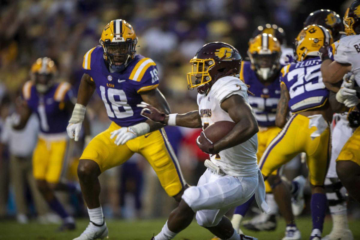 LSU football senior leftback Damone Clark (18) stares down Central Michigan football runningback Lew Nicholis III (7) Saturday, Sept. 18, 2021, during the LSU vs Central Michigan game in Tiger Stadium.