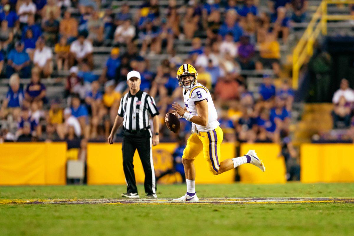 LSU football freshman quarterback Garrett Nussmeier (5) runs the ball Saturday, Sept. 11, 2021, during LSU's 34-7 win against McNeese at Tiger Stadium in Baton Rouge, La.