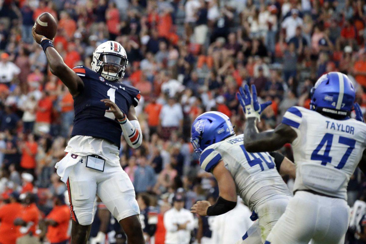 Auburn quarterback TJ Finley (1) throws a pass for a touchdown to take the lead over Georgia State in the final minute of the second half of an NCAA football game Saturday, Sept. 25, 2021, in Auburn, Ala. (AP Photo/Butch Dill)