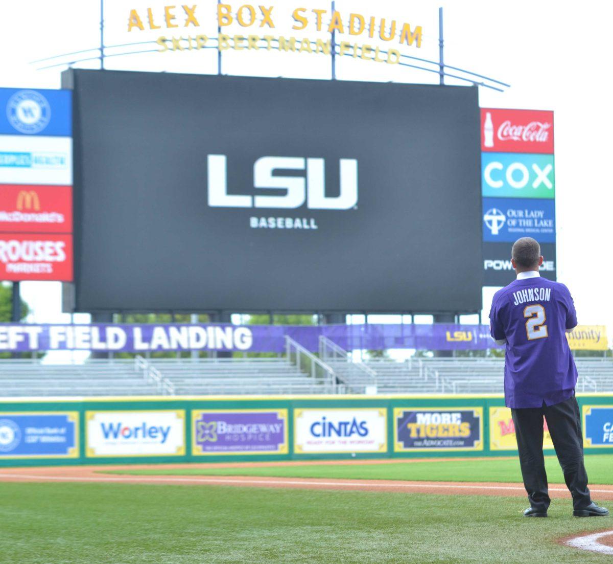 LSU baseball Head Coach Jay Johnson gazes up at the Alex Box Stadium scoreboard at his introduction on June 28, 2021.&#160;