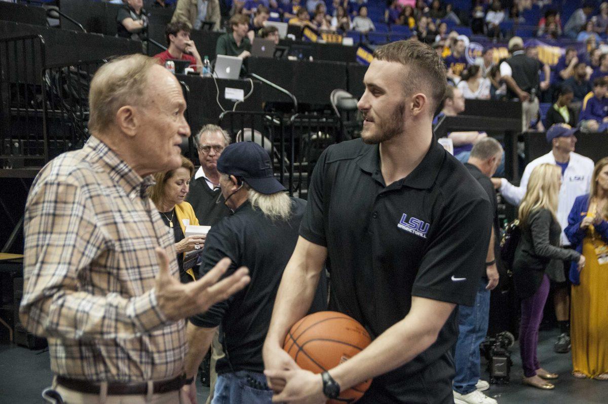 LSU former basketball head coach Dale Brown shakes senior guard Keith Hornsby (4) hand during the pre-game warmups during the Tigers&#8217; game against Missouri on Tuesday, March 1, 2016 in the PMAC.