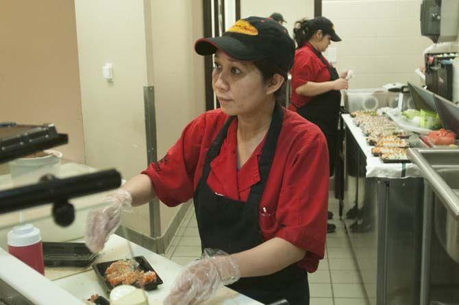 Marie Hla cooks sushi on Tuesday, Abril 2015, at the union&#8217;s On The Geaux food service.