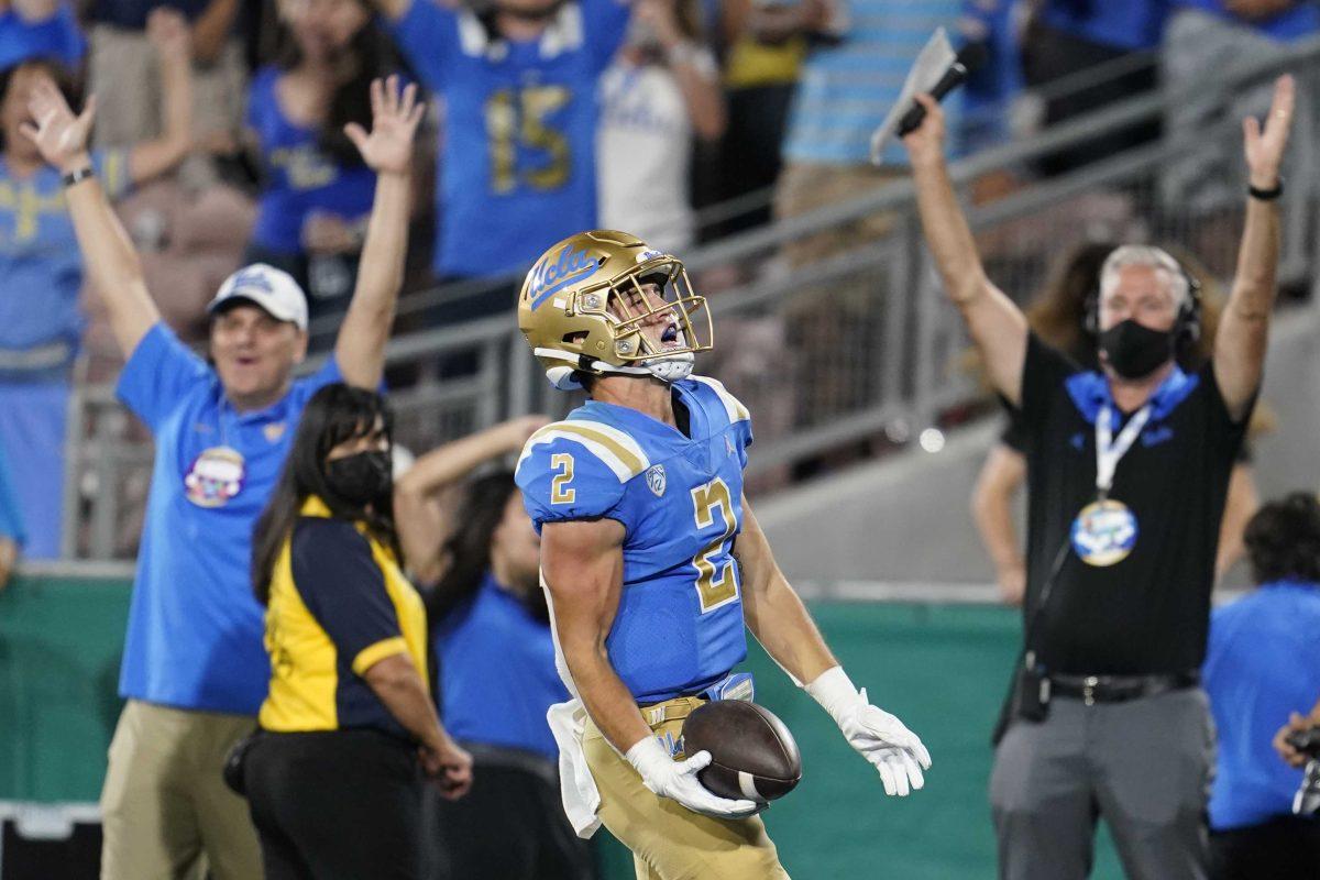 UCLA wide receiver Kyle Philips scores against LSU during the second half of an NCAA college football game Saturday, Sept. 4, 2021, in Pasadena, Calif. (AP Photo/Marcio Jose Sanchez)