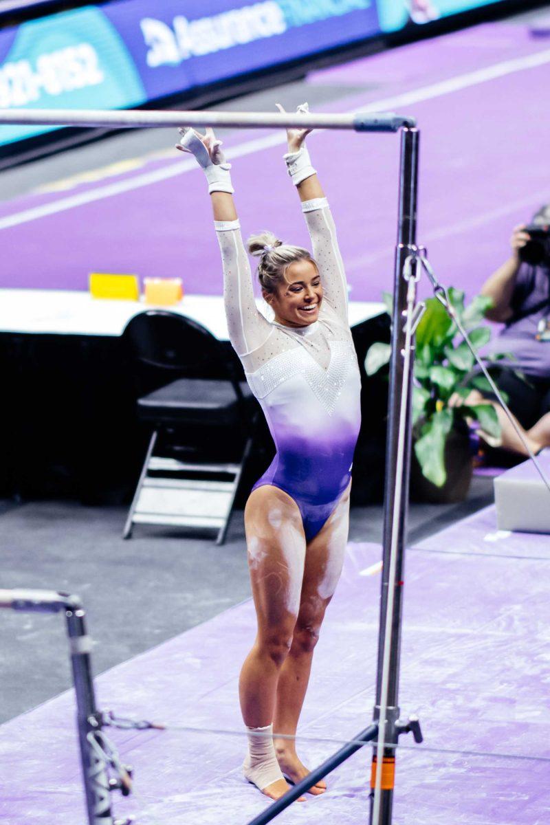 LSU gymnastics freshman all-around Olivia Dunne smiles after her uneven bars routine Friday, March 3, 2021 during LSU's 197.875-196.175 win over Missouri in the Pete Maravich Assembly Center on N. Stadium Drive in Baton Rouge, La.