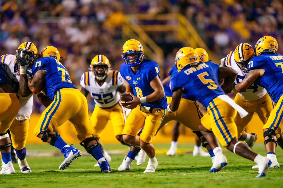 McNeese football graduate student quarterback Cody Orgeron (8) gets ready to hand off the ball Saturday, Sept. 11, 2021, during LSU's 34-7 win against McNeese at Tiger Stadium in Baton Rouge, La.