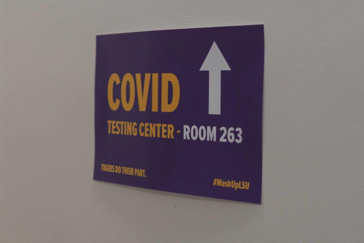 A sign reads &#8220;Covid Testing Center- Room 263&#8221; on Jan. 25, 2021 in a stairwell of Coates Hall.